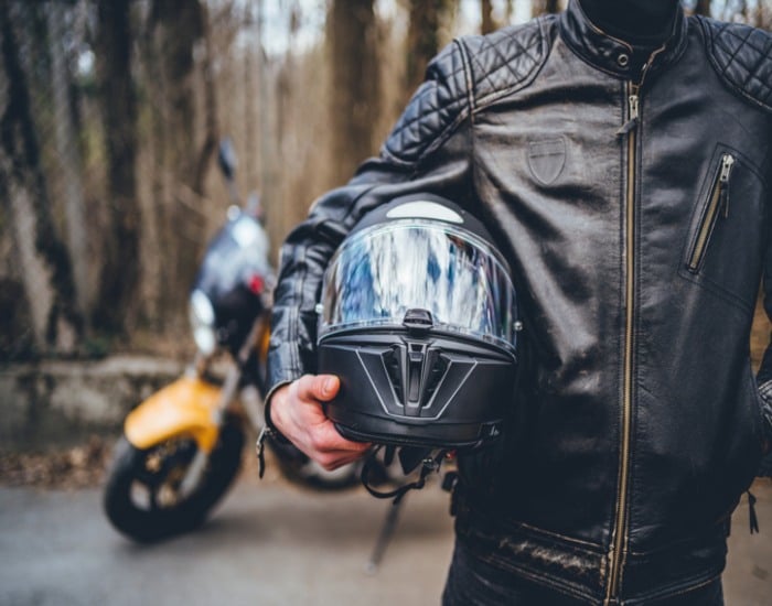 Motorcycle Rider Wearing Helmet and Safety Gear For Protection in Fort Collins, CO