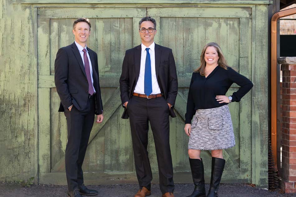 HSD partners standing in front of a green door in Fort Collins, CO